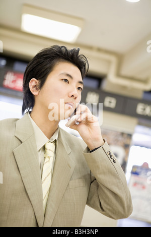 Businessman talking with cellular phone Stock Photo