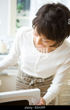 Housewife cooking in kitchen Stock Photo