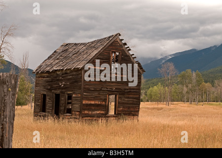 Old abandoned school house in extreme disrepair. Stock Photo