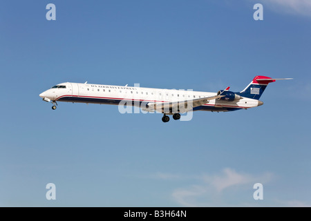 A US Airways Express Bombadier on finals at LAX Stock Photo