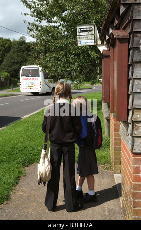 Children waiting at bus stop outside a bus shelter Stock Photo - Alamy