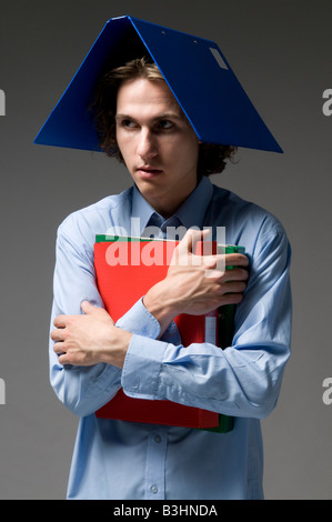 Young man with files on his head Stock Photo