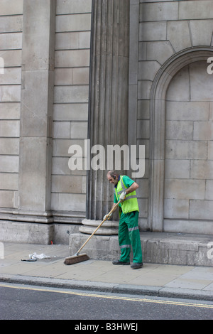 sweeper sweep  broom, Street cleaner bank of england building threadneedle street london Stock Photo