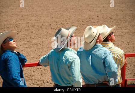 young cowboys man watching looking into sky town wyoming cheyenne usa cowboy hat rural lifestile rural Stock Photo