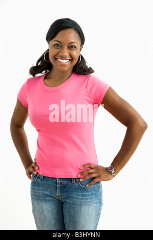 Portrait of smiling African American female standing looking at viewer Stock Photo