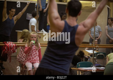 5 year-old girl fan of High School Musical watches cast rehearsing song and dance routines at the Dance Attic, Fulham, London Stock Photo
