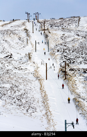 Winter sportsmen using the ski lift at Glenshee Ski Centre, Cairnwell, south of Braemar, Aberdeenshire, Scotland UK Stock Photo