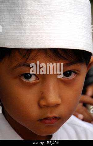 muslim boy at islamic school in muslim neighbourhood , kuta , bali , indonesia Stock Photo