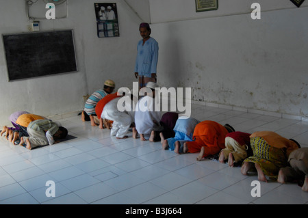 muslim children at the charity  sponsored islamic school in slum neighbourhood in kuta , bali , indonesia Stock Photo