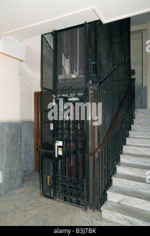 An old fashioned elevator in an apartment building in Nice on the Cote d'Azur southern France Stock Photo