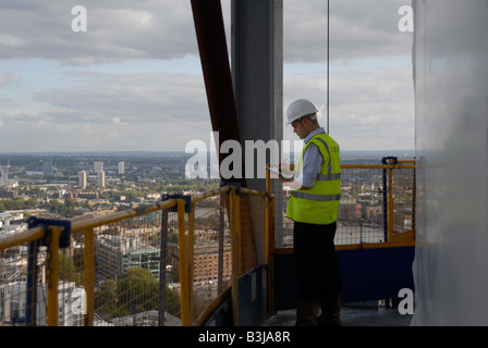 construction worker taking notes Stock Photo
