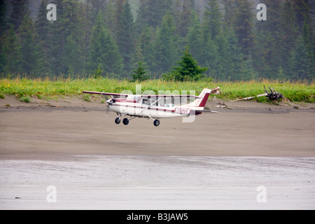 Airplane lands on beach in Lake Clark National Park Alaska Stock Photo