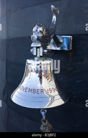 Silver Royal Navy ship's bell of HMS Vigilant, a British Vanguard class nuclear submarine while docked at HM Naval Base Clyde Stock Photo