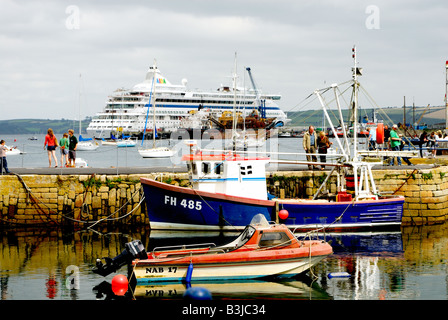 Falmouth harbour with fishing boats and cruise liner Stock Photo