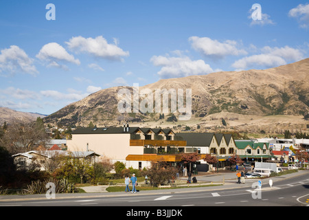 Wanaka Otago South Island New Zealand May View along main street of lakeside resort town with southern mountains beyond Stock Photo