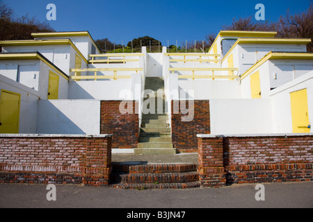 Rising terrace of beach huts facing the sea in Folkestone Kent Stock Photo