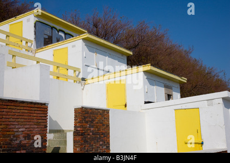 Rising terrace of beach huts facing the sea in Folkestone Kent Stock Photo