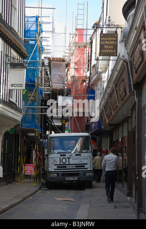 Alleyway restricted by scaffolding and building works in Canterbury Kent Stock Photo