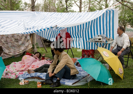 Survivors of the earthquake in Sichuan on 12 May 2008 living in makeshift camps in a park, Sichuan, China. Stock Photo