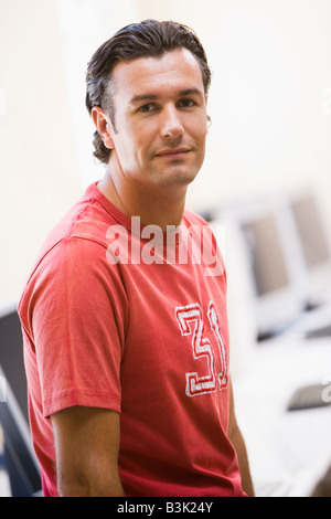 Man standing in computer room Stock Photo
