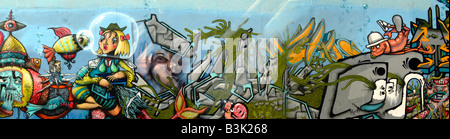 Multicolor graffiti with sea monsters on the stone wall (urban background) Stock Photo