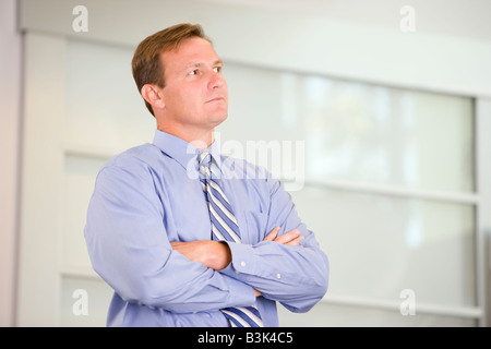 Portrait of a businessman standing with his arms crossed Stock Photo ...