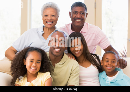 Extended family sitting on sofa Stock Photo