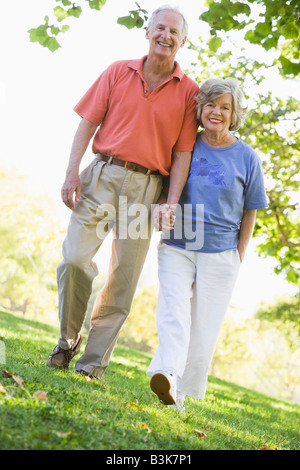 Senior couple walking in park together Stock Photo