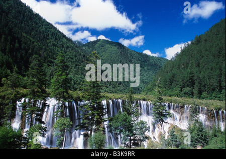 A large waterfall at the forested mountains of Jiuzhaigou Nature Reserve in Sichuan province China Stock Photo