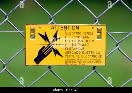 Electric fence warning sign Stock Photo