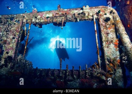 A surface view of a small boat from the engine room roof light of the MV Giannis D shipwreck at Sha'ab Abu Nuhas in the Red Sea Stock Photo