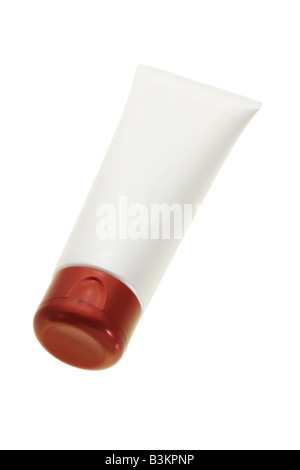 Blank cosmetic tube in creamy white color and red cap Stock Photo