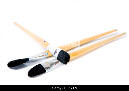 Three artist paintbrushes ready to be used Stock Photo