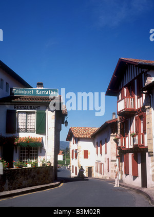 Basque Foothills Basque architecture in the village of Ascain at the foothills of the ...