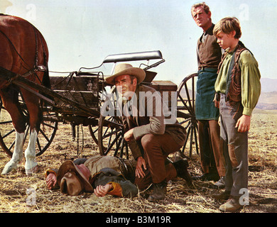 KILLER ON A HORSE aka Welcome To Hard Times 1967 MGM film with Henry Fonda kneeling Stock Photo