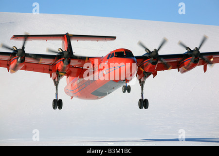 Aircraft taking off from blue ice runway in Antarctica Stock Photo