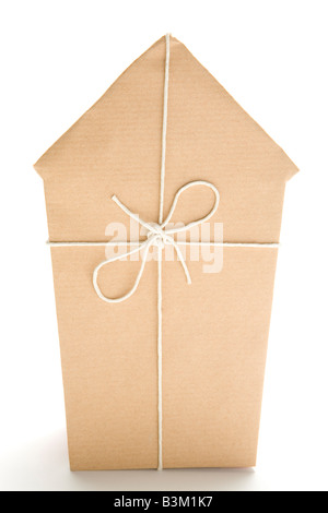 Studio Shot Of House Wrapped In Brown Paper And Tied With String Stock Photo