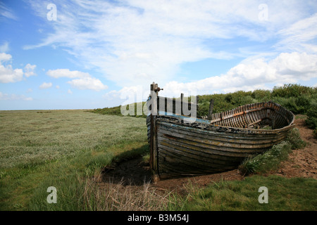 Wrecked boat on Cley Salt Marsh Stock Photo