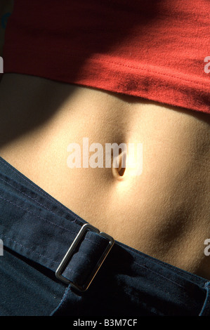 Young womans belly button Stock Photo