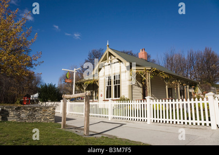 Arrowtown Otago South Island New Zealand May Guest House in old wooden building with horse rail in former gold mining town Stock Photo