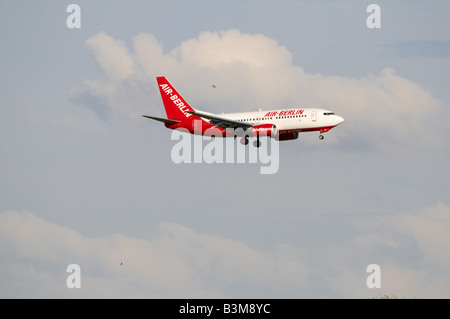 Airbus A319 Air Berlin Aircraft approaching Stansted Airport with birds flying around - bird strike worry Stock Photo