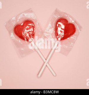 Red heart-shaped lollipops, elevated view Stock Photo