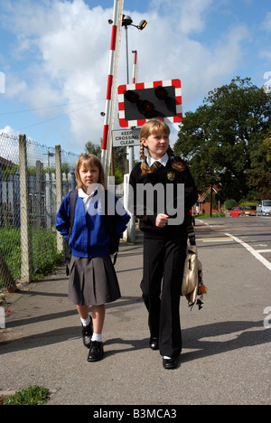 Schoolgirl in school uniform walking Stock Photo - Alamy