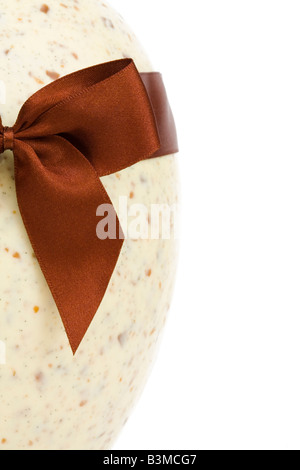 Luxury chocolate easter egg with ribbon with copy space to right and clipping path Stock Photo
