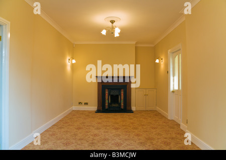 Empty room with open Victorian fireplace, PR Stock Photo