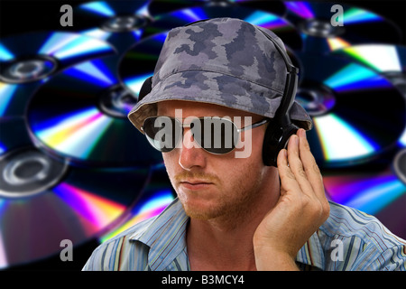 DJ with Hand on Headphones against an Abstract CD Background Stock Photo