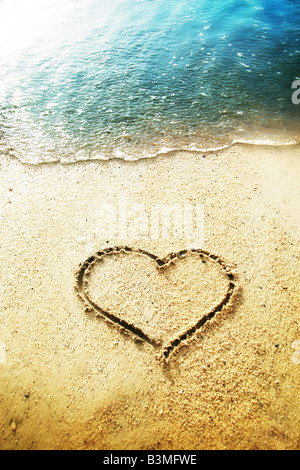 heart shape drawn in the sand Stock Photo