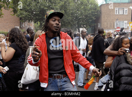 Dancing in side street Notting Hill Carnival Stock Photo