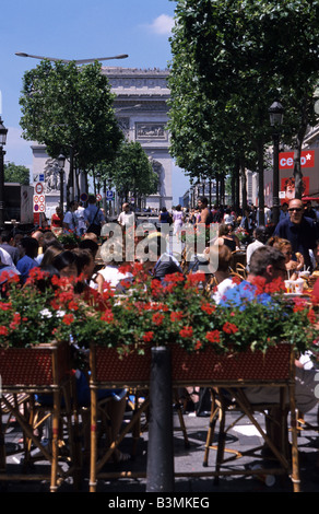 France Paris Street cafe along the Champs Elysees looking towards the Arc de Triomphe Stock Photo