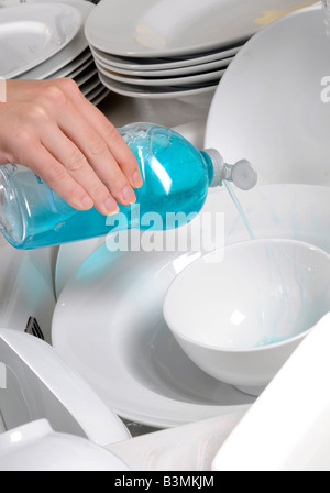 blue washing up dish with cleaning tools and detergents as degreaser and a  brush with wipes Stock Photo - Alamy